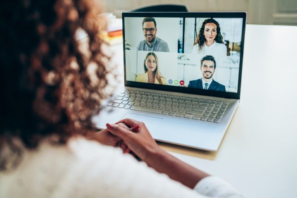 African-american businesswoman talking to her colleagues about business plan in video conference. Multi-ethnic business team using laptop for a online meeting in video call. Young woman working at home. Unrecognizable businesswoman discussing with colleagues with video call. Shot of a business person using a laptop for web conference.